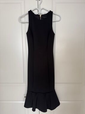 Sleeveless Black Sheath Dress with Fluted Hem